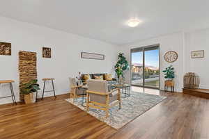 Living room with wood finished floors and baseboards