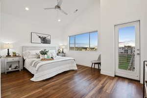 Bedroom with access to exterior, recessed lighting, wood finished floors, high vaulted ceiling, and baseboards