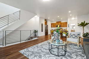 Living area featuring recessed lighting, wood finished floors, and baseboards