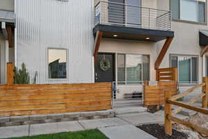Doorway to property with a balcony