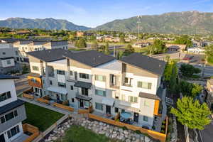 Aerial view of residential area featuring a mountain backdrop