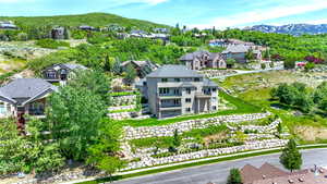 Aerial perspective of suburban area with a mountainous background
