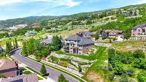 Aerial perspective of suburban area with a mountain backdrop