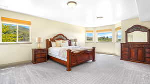 Carpeted bedroom featuring baseboards