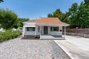 Bungalow-style house with covered porch and roof with shingles
