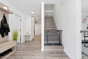 Entrance with stairway leading to attic space