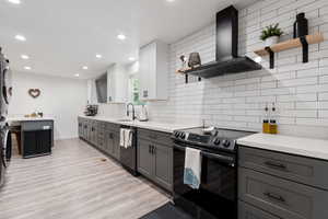 Beautifully updated kitchen with two toned custom cabinets and black stainless steel appliances