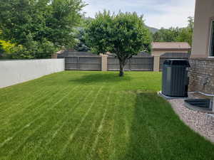 View of yard featuring central AC