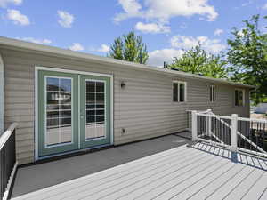 Wooden deck featuring french doors