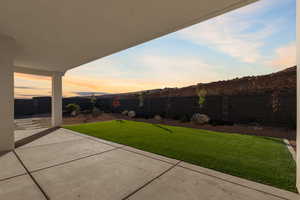 Fenced backyard featuring a patio area