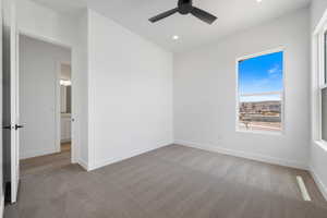 Unfurnished bedroom with carpet flooring, baseboards, recessed lighting, and ceiling fan