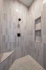 Bathroom featuring tiled shower