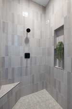 Bathroom featuring tiled shower