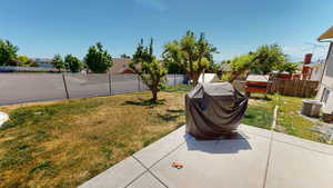 View of yard with a patio area and central AC