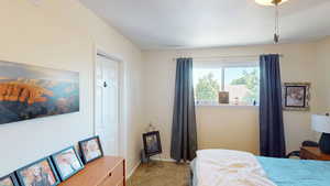 Bedroom with carpet and baseboards