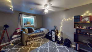 Bedroom featuring baseboards and a ceiling fan
