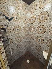 Full bath with tile patterned flooring and a tile shower
