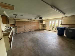 Garage featuring a garage door opener