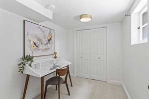 Office featuring baseboards and light carpet
