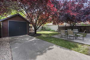 View of yard featuring a patio area and outdoor dining area