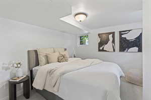 Carpeted bedroom with baseboards