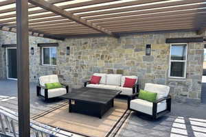 View of patio featuring outdoor lounge area and a pergola