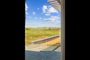 Entryway with a mountain view and a view of rural / pastoral area