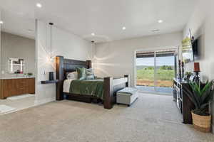 Bedroom with access to outside, light carpet, recessed lighting, and connected bathroom