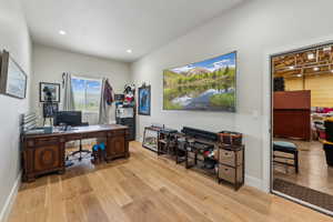 Office area with wood finished floors, baseboards, and recessed lighting