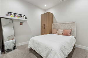 Bedroom featuring carpet floors, baseboards, and recessed lighting