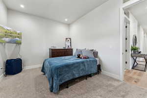 Bedroom featuring carpet, baseboards, and recessed lighting