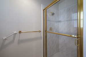 Bathroom featuring a shower stall