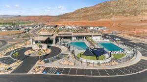 Aerial overview of property's location with a pool area and a mountain backdrop