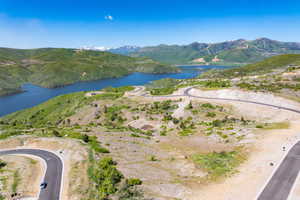 Aerial view of property's location with a water and mountain view