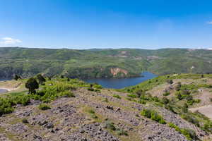 View of mountain background featuring a nearby body of water