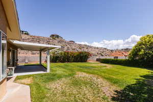 View of yard featuring a patio area and a mountain view