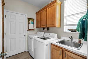 Laundry room featuring washer and dryer and cabinet space