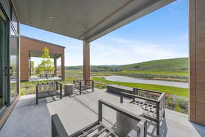 View of patio / terrace with a water view