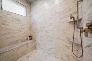 Full bath with tiled shower