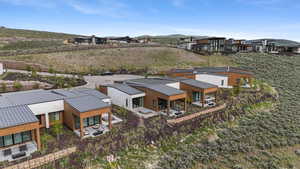 Aerial perspective of suburban area with a mountainous background