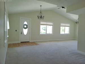 Entrance to large formal living room with a lofted ceiling