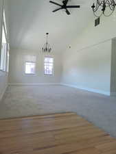 Formal living room with vaulted ceiling