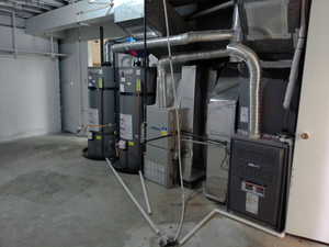 Utilities with two strapped, newer water heaters, and three furnaces (two are newer)