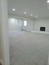 Giant basement family room with separate walkout to outside, and giant fireplace.