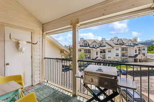 Balcony with a residential view and area for grilling
