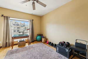 Miscellaneous room featuring ceiling fan and wood finished floors