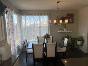 Dining room featuring plenty of natural light and baseboards