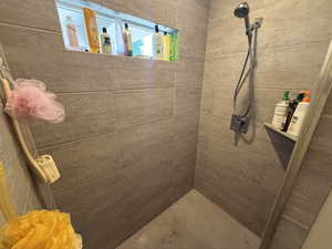 Bathroom with tiled shower