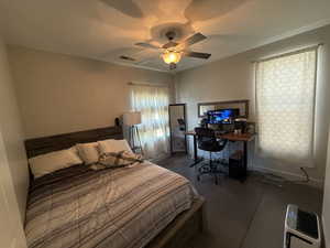 Bedroom featuring a ceiling fan and an office area