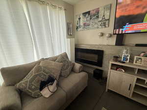 Living room with a glass covered fireplace